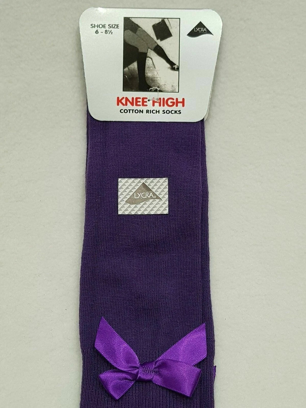 GIRLS KNEE HIGH COTTON LYCRA SOCKS WITH MATCHING BOW.