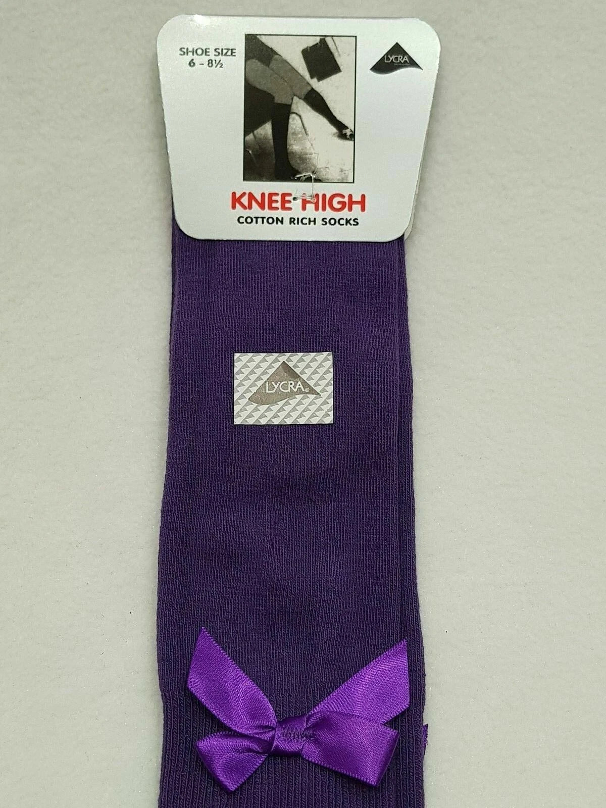 GIRLS KNEE HIGH COTTON LYCRA SOCKS WITH MATCHING BOW.